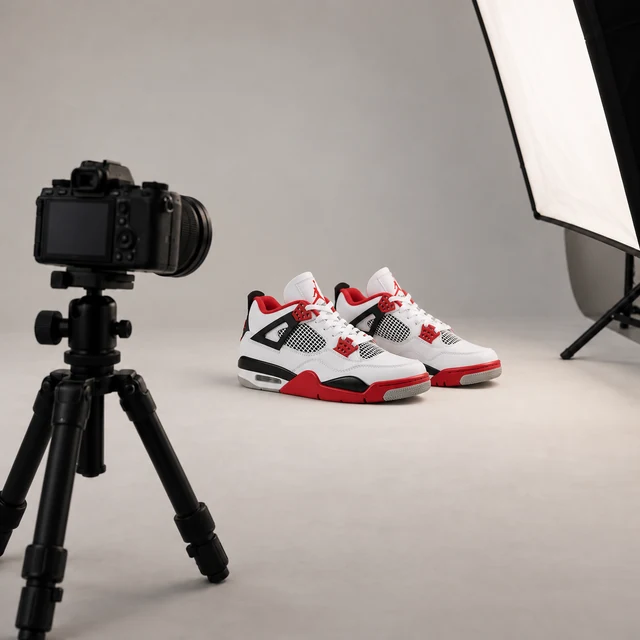 A studio camera directed at sneakers for detailed photographs